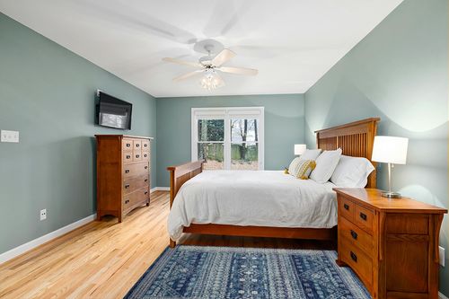 HomeRoots 4' X 6' Navy Blue Power Loom Area Rug in Teal and Orange Wood Bedroom