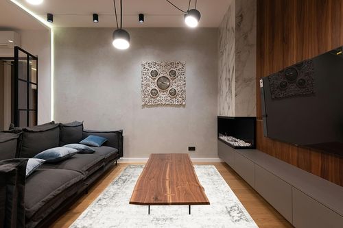 Unique Loom Sofia Collection Area Rug - Casino (6' 1" x 9' Rectangle, Gray/ Beige) in Dark Wood Living Room with Black Couch