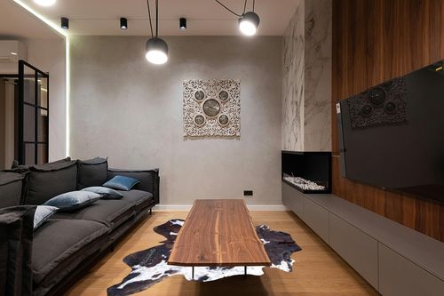rodeo Genuine Cowhide Rug: Hand-Picked & Authentic Real Cowhide Rug for Country Home Decor - Cow Hide Rug Large Sized at 6x7ft - Cozy, Unique, Durable, Leather Cow Carpet Rugs - Brindle Nutella in Dark Wood Living Room with Black Couch