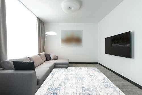 SAFAVIEH Amelia Collection Area Rug - 8' x 10', Ivory & Blue, Modern Abstract Design, Non-Shedding & Easy Care, Ideal for High Traffic Areas in Living Room, Bedroom (ALA700A) in Modern Living Room with Grey Couch
