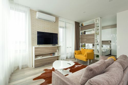Genuine Brown and White Cowhide Rug XL 6 x 7-8 ft. 180 x 240 cm in Light Modern Living Room with TV