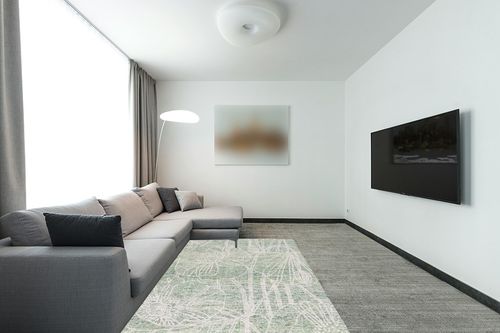 SAFAVIEH Metro Collection Area Rug - 5' x 8', Green & Ivory, Handmade Floral Wool, Ideal for High Traffic Areas in Living Room, Bedroom (MET875Y) in Modern Living Room with Grey Couch