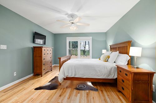 Sunshine Cowhides Genuine Mahogany Brown Cowhide Rug - Luxurious Cow Rug for Bedroom, Living Room, and Home Decor Enthusiasts - Masterpiece of Style and Functionality - XL 6x7-8ft (180x240cm) in Teal and Orange Wood Bedroom