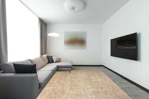Loloi Magnolia Home by Joanna Gaines Junie Collection JUE-02 Oatmeal/Smoke 7'-10" x 10'-2", .38" Pile Height, Area Rug in Modern Living Room with Grey Couch
