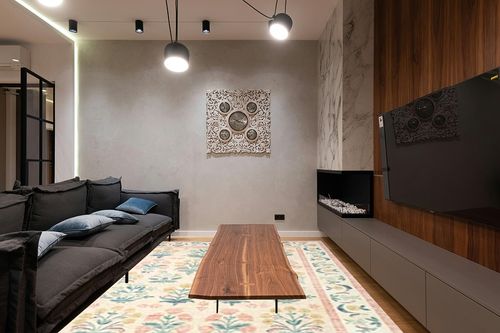 Loloi Rifle Paper Co. x Eden Mughal Rose Blush 8'-6" x 11'-6" Area Rug in Dark Wood Living Room with Black Couch
