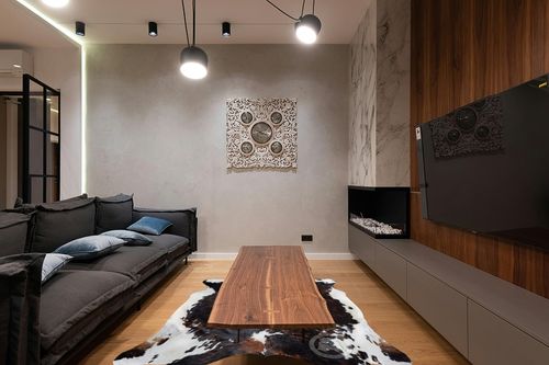 Sunshine Cowhides Genuine Brindle Dark Tricolor Cowhide Rug - Luxurious Cow Rug for Bedroom, Living Room, and Home Decor Enthusiasts - Masterpiece of Style and Functionality - 6x6-7ft (180x210cm) in Dark Wood Living Room with Black Couch