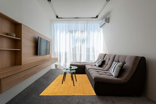 Rugs.com Zermatt Shag Collection Rug – 5' x 8' Sun Yellow Shag Rug Perfect for Bedrooms, Dining Rooms, Living Rooms in Grey Living Room with Brown Couch