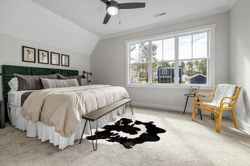 Cowhides Direct Genuine Cowhide Rug - Black & White Rug for Living Room, Bedroom & More - Authentic Cow Rug (6’x7’ Black & White) in Grey Traditional Bedroom with King Bed