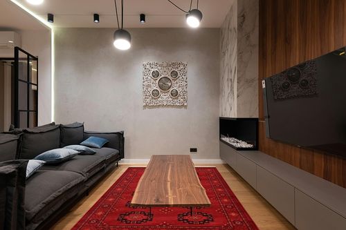 Unique Loom Tekke Collection Over-Dyed Saturated Traditional Torkaman Area Rug, 6 ft 0 in x 9 ft 0 in, Red/Black in Dark Wood Living Room with Black Couch