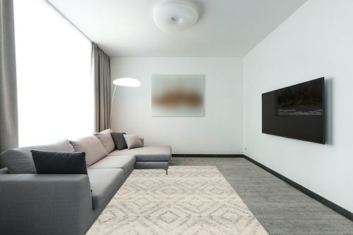SAFAVIEH Adirondack Collection Area Rug - 6' x 9', Ivory & Light Blue, Modern Diamond Distressed Design, Non-Shedding & Easy Care, Ideal for High Traffic Areas in Living Room, Bedroom (ADR131T) in Modern Living Room with Grey Couch