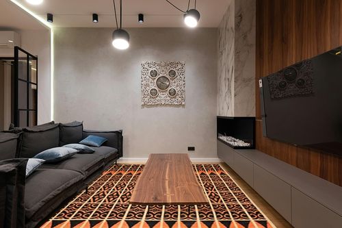 SAFAVIEH Kenya Collection Area Rug - 8' x 10', Orange & Black, Hand-Knotted Moroccan Boho Tribal Wool, Ideal for High Traffic Areas in Living Room, Bedroom (KNY609A) in Dark Wood Living Room with Black Couch