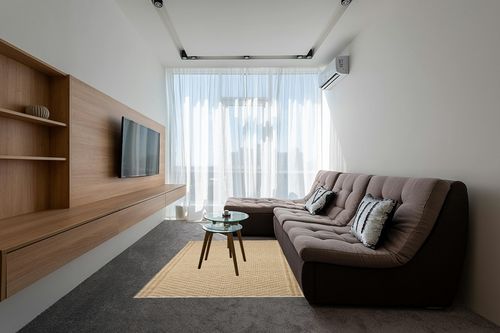 Angela Rose x Loloi 5'0" 7'0" Natural/Ivory Colton CON-04 Area Rug in Grey Living Room with Brown Couch