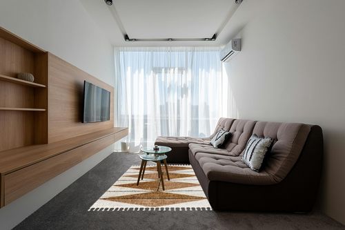 nuLOOM Kali Shaggy Diamond Tassel Area Rug, 5x8, Light Brown in Grey Living Room with Brown Couch