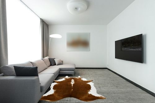 BENRON Large Cowhide Rug 5.3x6.2ft Area Rug Traditional Animal Rug Stylish Bedroom Rug Cow Print Rugs for Living Room Western Decor Room Decoration Carpets,Khaki Brown in Modern Living Room with Grey Couch