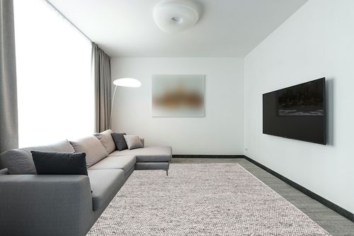 SAFAVIEH Natura Collection Area Rug - 9' x 12', Light Grey & Ivory, Handmade Farmhouse Wool, Ideal for High Traffic Areas in Living Room, Bedroom (NAT620G) in Modern Living Room with Grey Couch