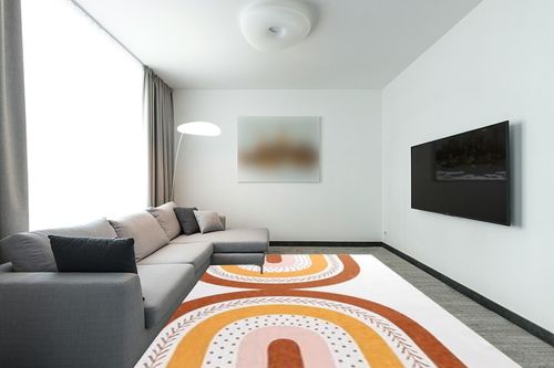 HOMBYS 9x12 Boho Area Rug for Living Room Bedroom, Large Modern Rainbow Floor Carpet with Non-Slip Backing for Indoor Office Dining Room, Home Deco Non-Shedding, Orange, Machine Washable ﻿ in Modern Living Room with Grey Couch