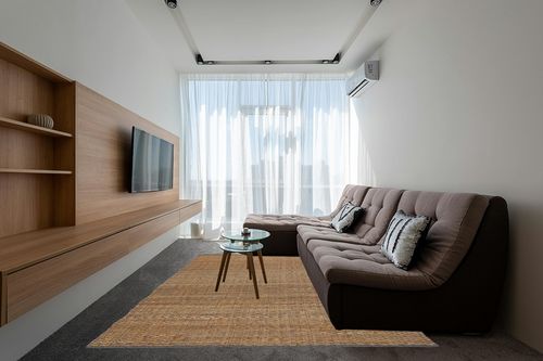 Pebble & Crane - Carlisle Rug - Woven Throw Rug - Jute and Cotton - Area Rug for Kitchen, Living Room, Bedroom, and More - Solid Trim - 8’ x 10’ - Grey in Grey Living Room with Brown Couch