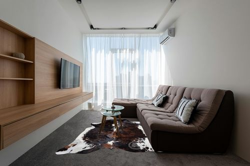 Sunshine Cowhides Genuine Brindle Dark Tricolor Cowhide Rug - Luxurious Cow Rug for Bedroom, Living Room, and Home Decor Enthusiasts - Masterpiece of Style and Functionality - XL 6x7-8ft (180x240cm) in Grey Living Room with Brown Couch