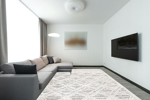 nuLOOM Ansley Moroccan Lattice Tassel Area Rug, 9' x 12', Beige in Modern Living Room with Grey Couch