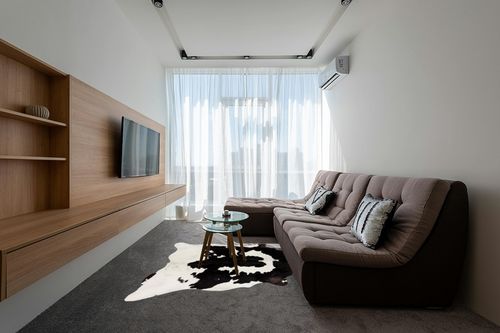 Cowhides Direct Genuine Cowhide Rug - Black & White Rug for Living Room, Bedroom & More - Authentic Cow Rug (6’x7’ Black & White) in Grey Living Room with Brown Couch