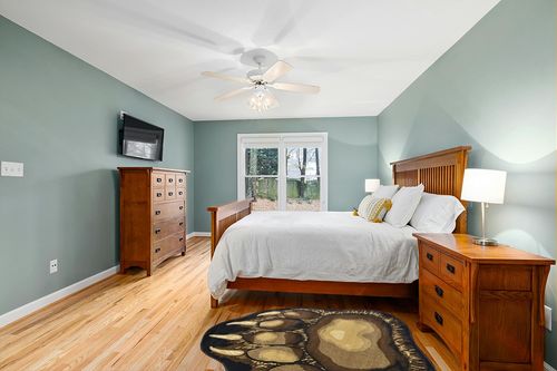 Bear Claw Rustic Lodge Paw Area Rug 3'8 W X 4'10 L in Teal and Orange Wood Bedroom