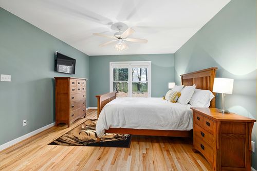 United Weavers of America Legends Collection Double Tigers Rug, 5'3" by 7'2" in Teal and Orange Wood Bedroom