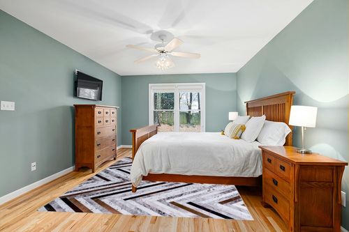 DECOMALL Coronado 8x10ft Area Rugs, Modern Geometric Faux Cowhide Patchwork Rug, Machine Washable Non Slip Carpet for Living Room Bedroom Dinning Room,8x10ft Multi in Teal and Orange Wood Bedroom