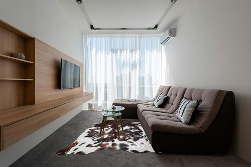Sunshine Cowhides Genuine Tricolor Brindle Cowhide Rug - Luxurious Cow Rug for Bedroom, Living Room, and Home Decor Enthusiasts - Masterpiece of Style and Functionality - XL 6x7-8ft (180x240cm) in Grey Living Room with Brown Couch