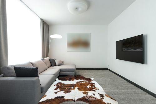Sunshine Cowhides Genuine Tricolor Cowhide Rug - Luxurious Cow Rug for Bedroom, Living Room, and Home Decor Enthusiasts - Masterpiece of Style and Functionality - 6x6-7ft (180x220cm) in Modern Living Room with Grey Couch