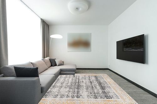 Rugshop Distressed Bohemian Border Stain Resistant Soft Area Rug 7' 10" x 10' Yellow in Modern Living Room with Grey Couch