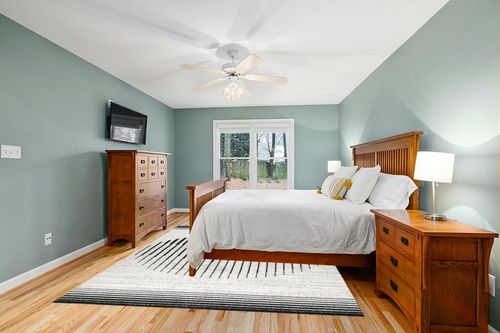 Lockie Abstract Black/White Area Rug Ebern Designs Rug Size: Rectangle 8' x 10' in Teal and Orange Wood Bedroom