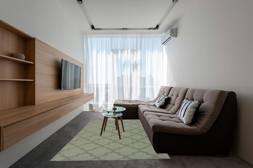Garland Rug Quatro 6 ft. x 9 ft. Area Rug Sage in Grey Living Room with Brown Couch