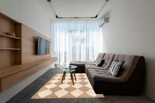 Rugs USA x Arvin Olano Louie Diamond Checkerboard Jute Area Rug, 6x9, Natural in Grey Living Room with Brown Couch