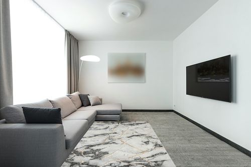 LUXE WEAVERS Ivory Gold 5x7 Marble Abstract Area Rug in Modern Living Room with Grey Couch