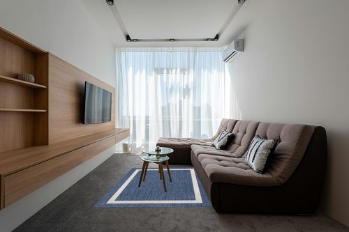 Akeira Power Loom Blue Rug Ebern Designs Rug Size Rectangle 5' x 7' in Grey Living Room with Brown Couch