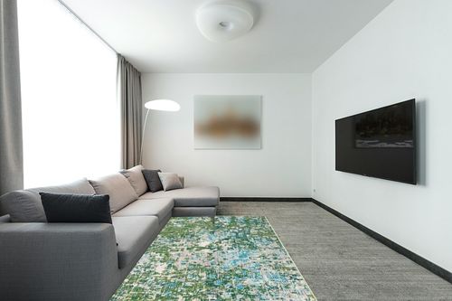 SAFAVIEH Madison Collection Area Rug - 5'3" x 7'6", Green & Turquoise, Boho Abstract Distressed Design, Non-Shedding & Easy Care, Ideal for High Traffic Areas in Living Room, Bedroom (MAD425Y) in Modern Living Room with Grey Couch