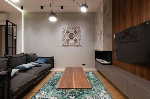 LUXE WEAVERS Moroccan Green 6x9 Medallion Area Rug for Living Rooms in Dark Wood Living Room with Black Couch