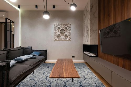 SAFAVIEH Madison Collection Area Rug - 8' x 10', Navy & Silver, Glam Ogee Trellis Distressed Design, Non-Shedding & Easy Care, Ideal for High Traffic Areas in Living Room, Bedroom (MAD604G) in Dark Wood Living Room with Black Couch