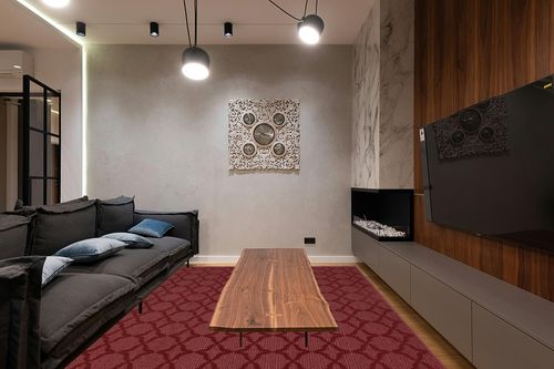 Garland Rug Sparta 8-Feet by 10-Feet Area Rug Chili Red in Dark Wood Living Room with Black Couch