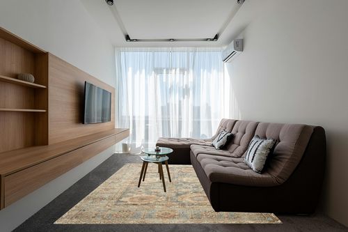 Loloi II Margot Collection MAT-03 Ocean/Spice 7'-6" x 9'-6" Area Rug feat. CloudPile in Grey Living Room with Brown Couch