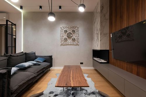 Faux Cowhide Rug Premium Cowhide Rug Large Cow Rug 8x6 Feet Rugs for Living Room Bedroom Dining Room Western Neutral Modern Rug Area Rugs Cow Print Rug Grey Rug Carpet in Dark Wood Living Room with Black Couch