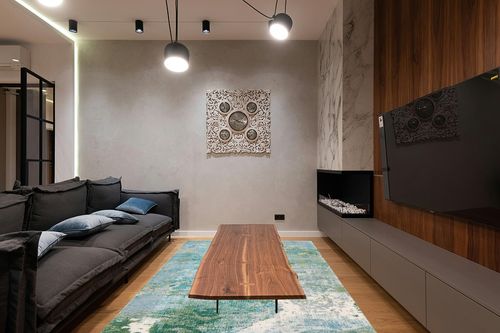 Safavieh Madison Collection Area Rug - 6' x 9', Light Blue & Green, Boho Abstract Design, Non-Shedding & Easy Care, Ideal for High Traffic Areas in Living Room, Bedroom (MAD440J) in Dark Wood Living Room with Black Couch