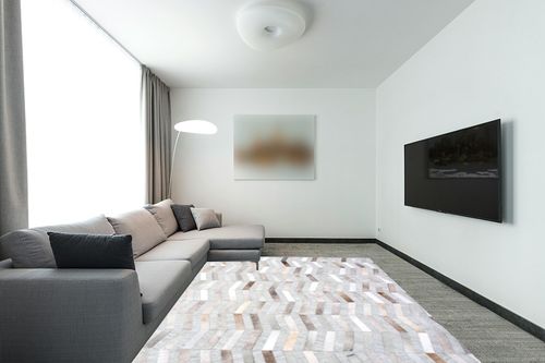 nuLOOM Cece Contemporary Cowhide Area Rug, 8x10, Silver in Modern Living Room with Grey Couch