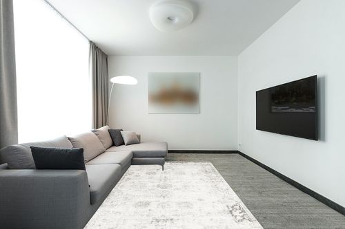 Unique Loom Sofia Collection Area Rug - Casino (6' 1" x 9' Rectangle, Gray/ Beige) in Modern Living Room with Grey Couch