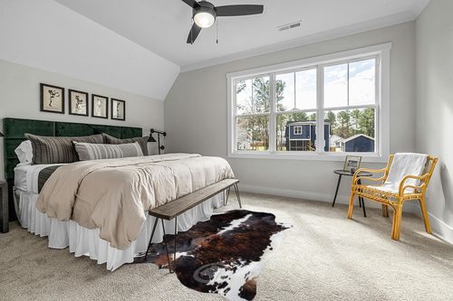 Sunshine Cowhides Genuine Brindle Dark Tricolor Cowhide Rug - Luxurious Cow Rug for Bedroom, Living Room, and Home Decor Enthusiasts - Masterpiece of Style and Functionality - XL 6x7-8ft (180x240cm) in Grey Traditional Bedroom with King Bed