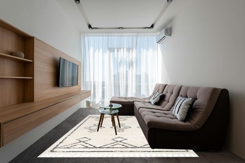 nuLOOM Mackie Moroccan Tasseled Shag Area Rug, 8x10, Off-white in Grey Living Room with Brown Couch