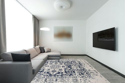 SAFAVIEH Madison Collection Area Rug - 8' x 10', Cream & Navy, Snowflake Medallion Distressed Design, Non-Shedding & Easy Care, Ideal for High Traffic Areas in Living Room, Bedroom (MAD603D) in Modern Living Room with Grey Couch