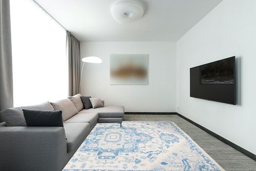 SAFAVIEH Micro-Loop Collection Area Rug - 8' x 10', Ivory & Blue, Handmade Shabby Chic Medallion Wool, Ideal for High Traffic Areas in Living Room, Bedroom (MLP503G) in Modern Living Room with Grey Couch