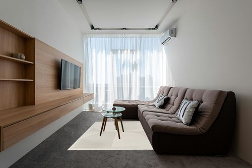 Mensa Cream Modern Geometric Area Rug Wade Logan Rug Size: Rectangle 5'3" x 7' in Grey Living Room with Brown Couch