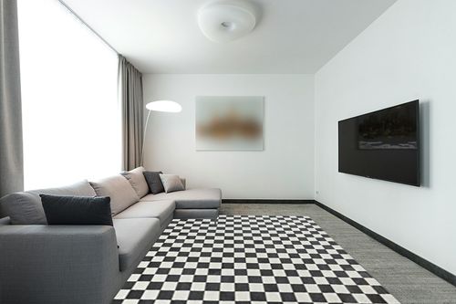 LUXE WEAVERS Geometric Checkered Gray and White 8x10 Area Rug in Modern Living Room with Grey Couch